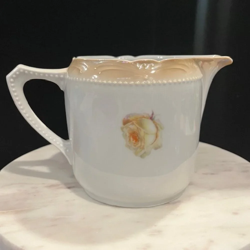German Porcelain Large Creamer with Roses and Beaded Handle